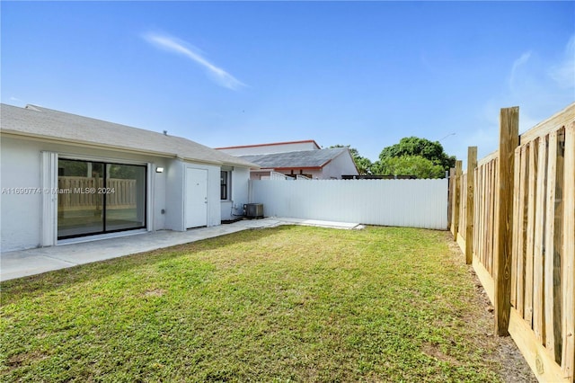 view of yard featuring central AC