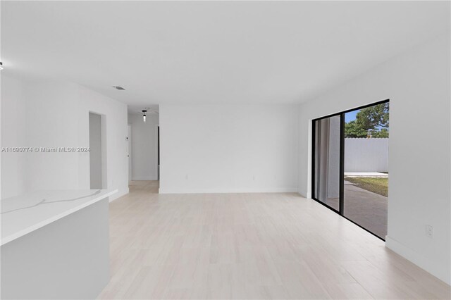 spare room with light hardwood / wood-style floors