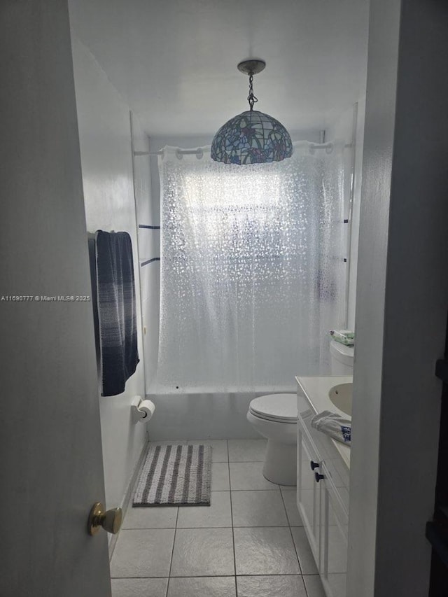 full bathroom featuring tile patterned flooring, vanity, bathtub / shower combination, and toilet