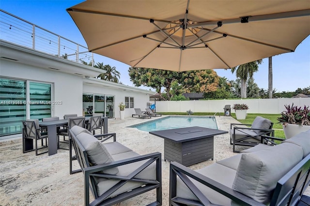 view of pool with outdoor lounge area and a patio area