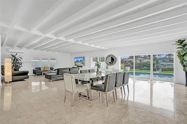 dining area featuring beamed ceiling and an AC wall unit