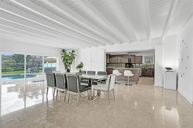 tiled dining area with beamed ceiling