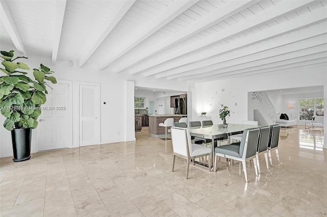 dining room with beamed ceiling