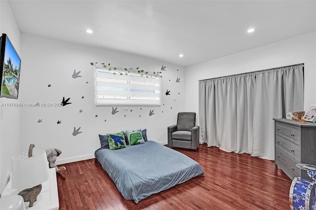 bedroom featuring dark hardwood / wood-style flooring