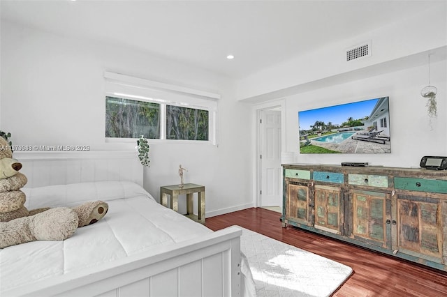 bedroom featuring dark wood-type flooring