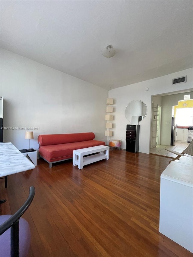 living room featuring dark wood-type flooring