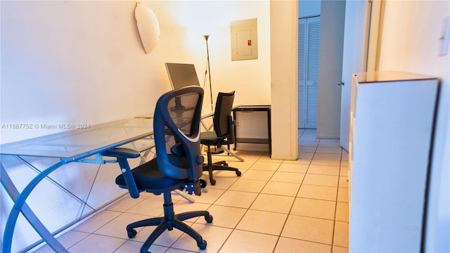 tiled office featuring electric panel