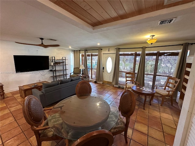 living room with tile patterned floors and ceiling fan