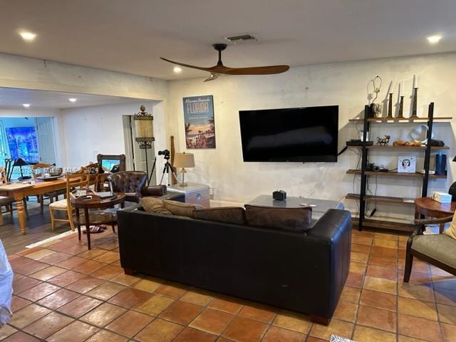 living room featuring ceiling fan