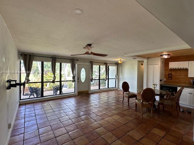 interior space featuring ceiling fan