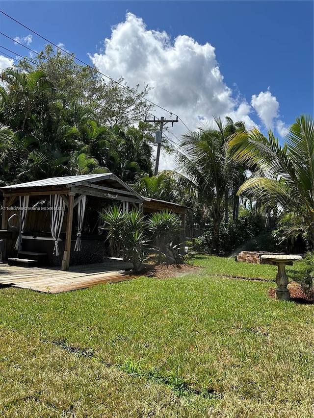 view of yard featuring a gazebo and a wooden deck