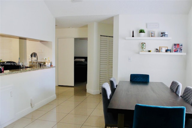 dining room featuring light tile patterned flooring