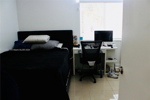 bedroom featuring light tile patterned flooring