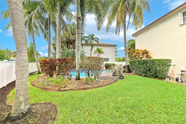 view of yard featuring a fenced in pool