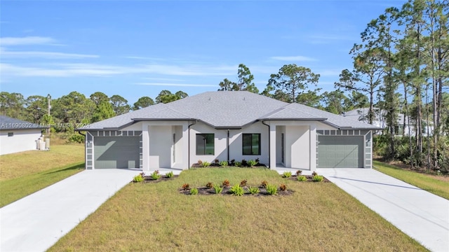 view of front of home featuring a garage and a front yard