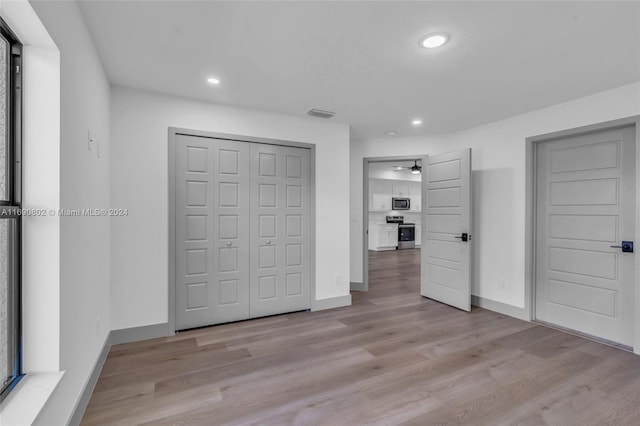 unfurnished bedroom featuring light wood-type flooring