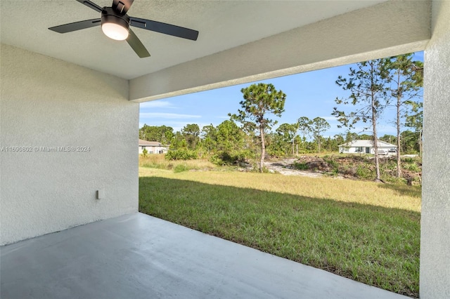 view of yard with a patio area and ceiling fan