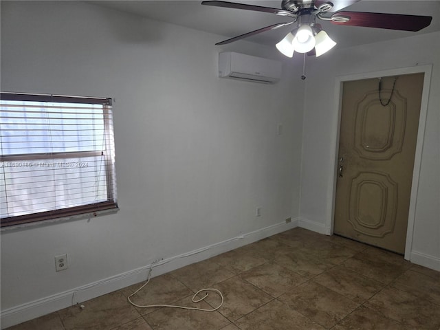 unfurnished bedroom featuring ceiling fan and a wall mounted AC