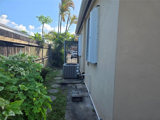 view of side of property with central AC