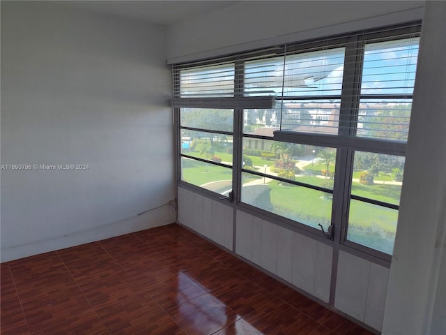 unfurnished sunroom featuring a healthy amount of sunlight