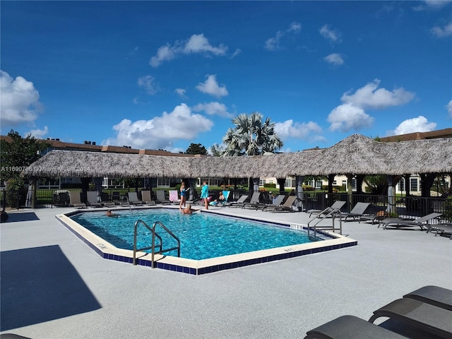 view of swimming pool with a patio area