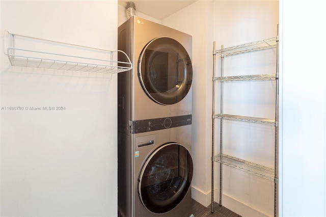 laundry area featuring stacked washer / dryer