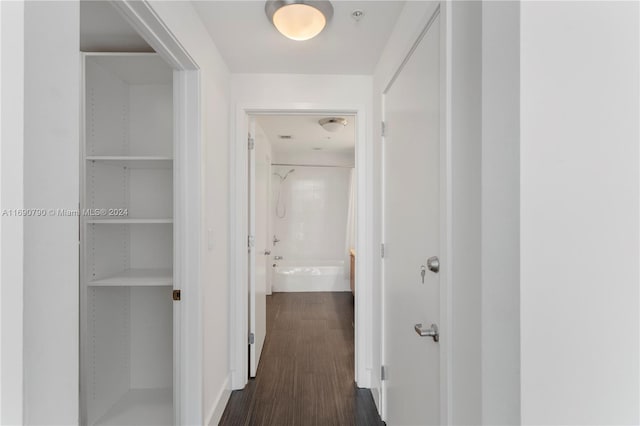 corridor featuring dark hardwood / wood-style flooring