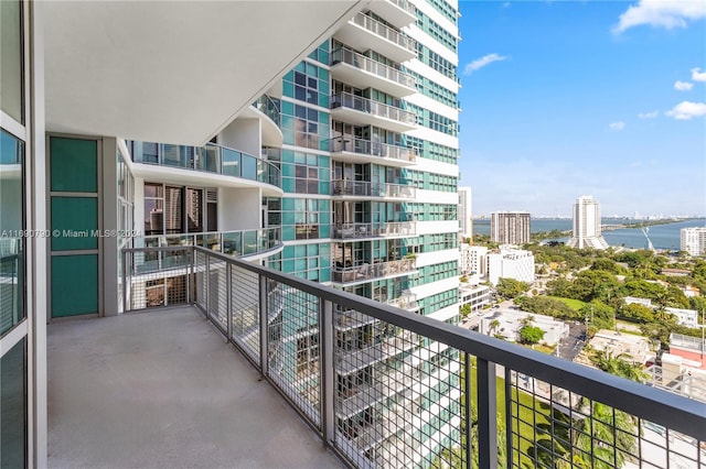 balcony featuring a water view