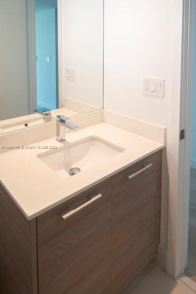 bathroom with vanity and tile patterned floors