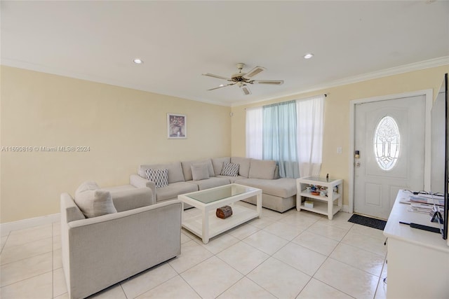 living room with light tile patterned flooring, ceiling fan, and ornamental molding