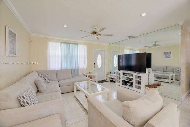 living room with ornamental molding, ceiling fan, and light tile patterned floors