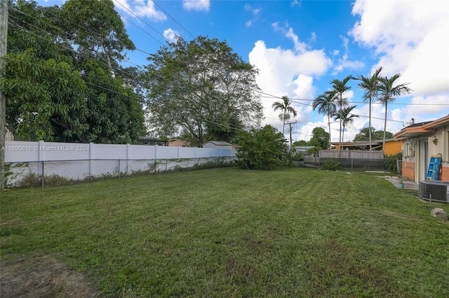 view of yard featuring central AC unit