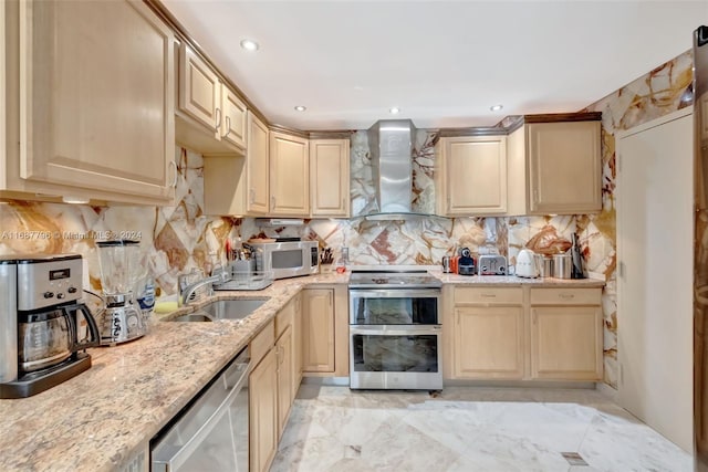 kitchen featuring light brown cabinets, backsplash, wall chimney range hood, sink, and stainless steel appliances