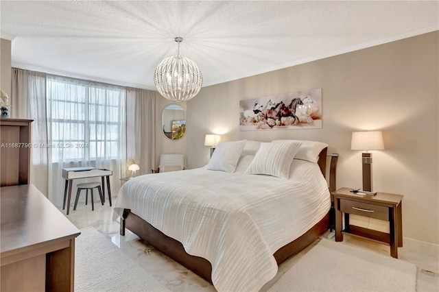 bedroom featuring an inviting chandelier