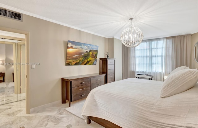 bedroom with a closet, a chandelier, and ornamental molding