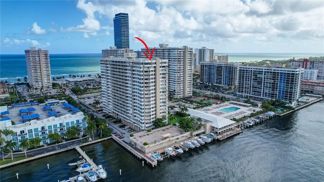 birds eye view of property with a water view