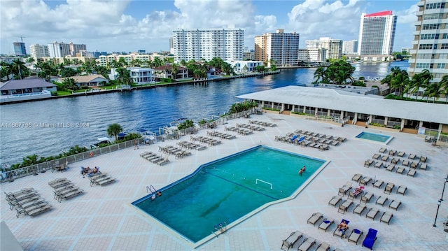 view of pool featuring a water view