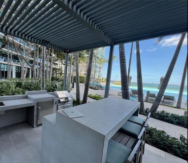 650 NE 32nd St Unit 602, Miami, FL 33137 - view of patio / terrace with a water view
