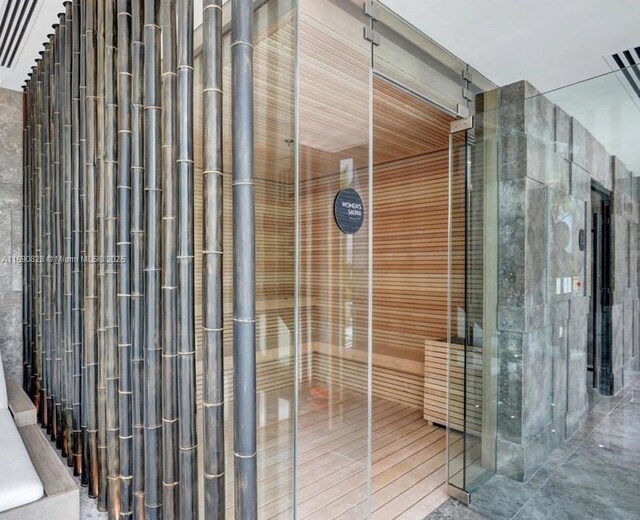 view of pool with an indoor in ground hot tub