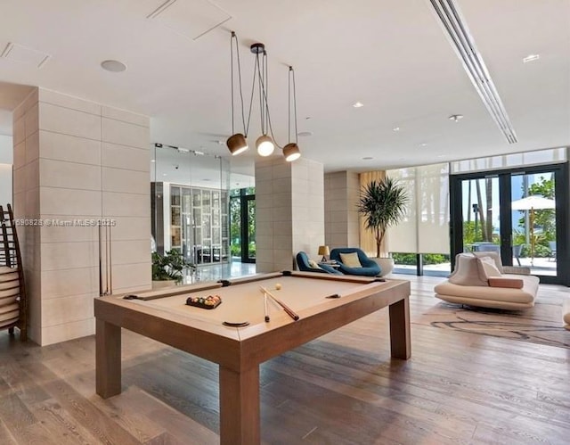 playroom featuring french doors, billiards, wood finished floors, and floor to ceiling windows
