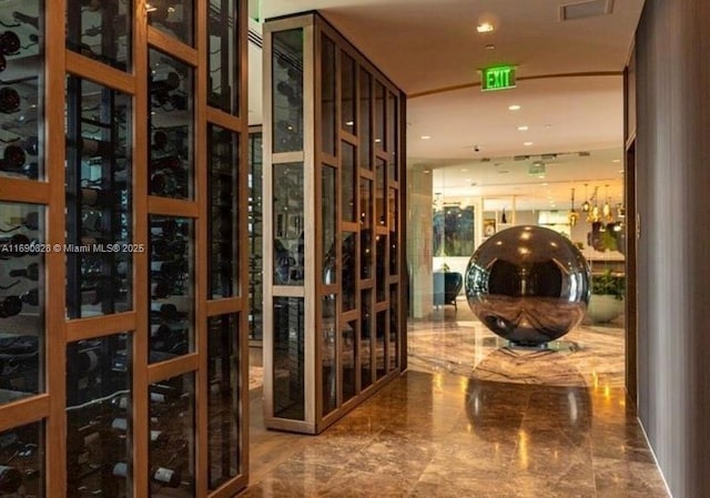 wine cellar with visible vents, marble finish floor, and recessed lighting
