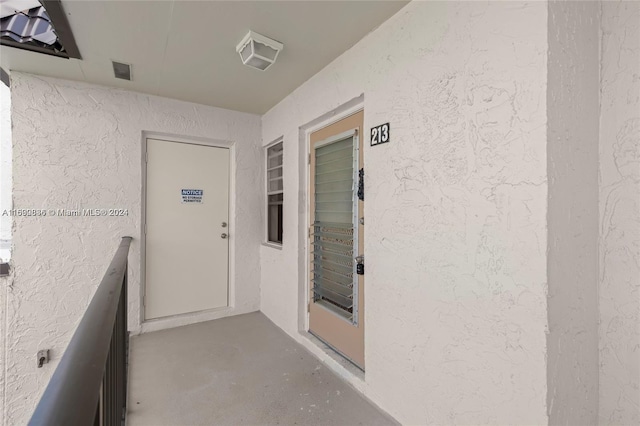 110 Lake Meryl Dr Unit 213, West Palm Beach, FL 33411 - entrance to property with stucco siding
