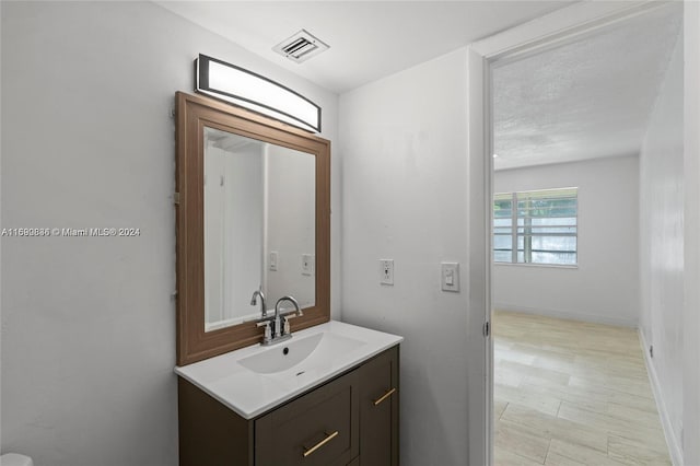 110 Lake Meryl Dr Unit 213, West Palm Beach, FL 33411 - bathroom featuring vanity and baseboards