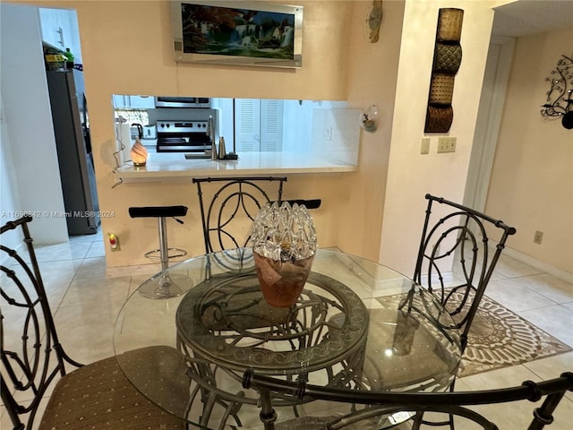 dining space with light tile patterned floors