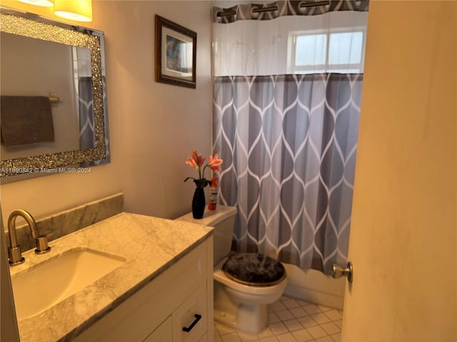 full bathroom with vanity, tile patterned floors, toilet, and shower / bathtub combination with curtain