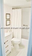 bathroom featuring tile patterned flooring and toilet