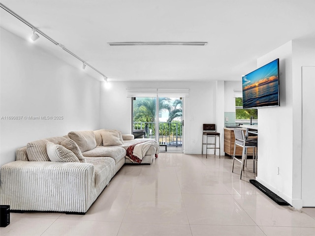 living room with light tile patterned flooring