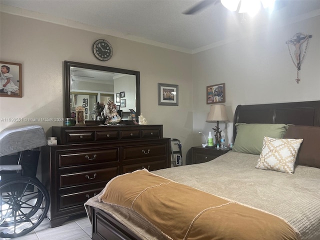 bedroom with light tile patterned flooring, ceiling fan, and crown molding
