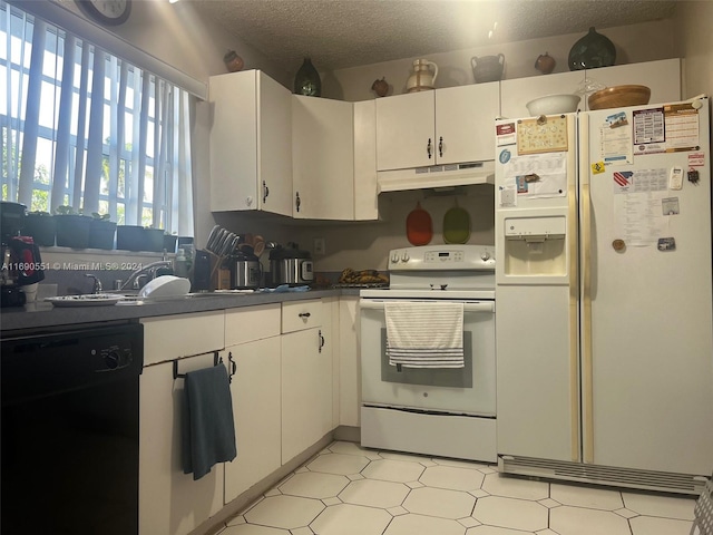 kitchen with white cabinetry, a textured ceiling, and white appliances