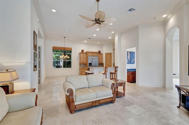 living room featuring ceiling fan and crown molding